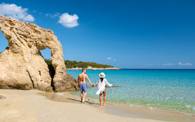 Voulisma Beach Istron Crete Greece, the most beautiful beaches of Crete island Istron Bay near Agios Nikolaos. A young couple on vacation in Greece Crete during the summer holidays