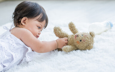 Adorable little baby daughter girl, crawling, laying down, relax on floor, good health, playing...