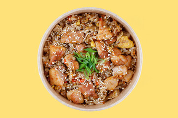 rice with  fried meat on a yellow background, studio shot 1