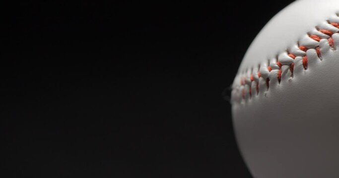 Baseball ball close up rotating in studio