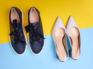 Two pairs of female modern shoes: open-back white pumps with black flare heels and casual navy blue...