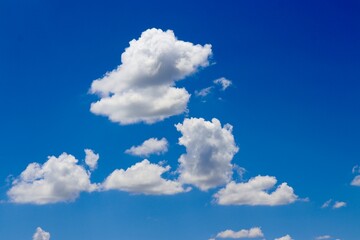 The white clouds in the blue sky.