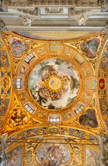 Fototapeta na wymiar GENOVA, ITALY - MARCH 6, 2023: The frescoes on the side cupola in church Basilica della Santissima Annunziata del Vastato probably by Giulio Benso from 18. cent..
