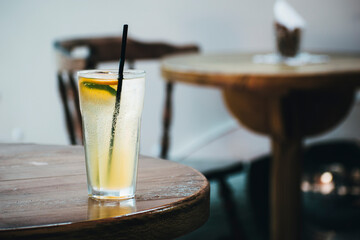 freshly made lemonade on the table in the cafe. Lemonade with ice was prepared in the summer cafe