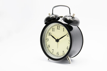 Black alarm clock isolated on white.