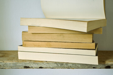 Old books on a wooden shelf