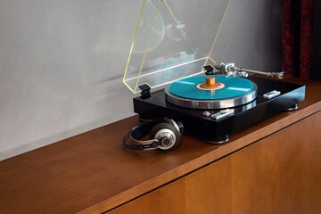 Vintage Stereo Turntable Record Player With Colored Disk, Headphones and Weight Clamp