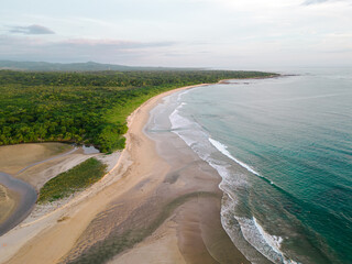 beautiful Sunset with green nature and blue ocean  From The Tamarindo Beach In Guanacaste In Costa Rica Drone Video top view Sunset 