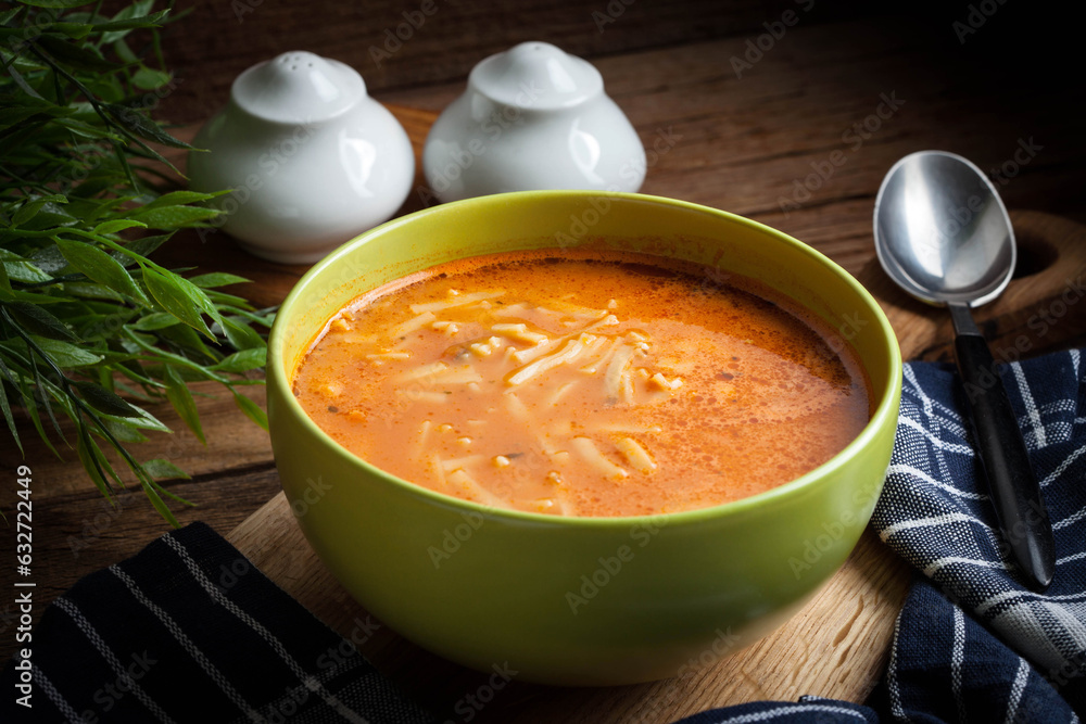 Poster Homemade tomato soup with noodles.