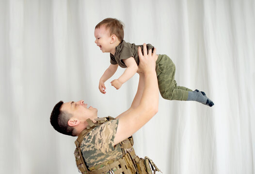 Ukrainian Soldier In Military Uniform Reunited With His Family