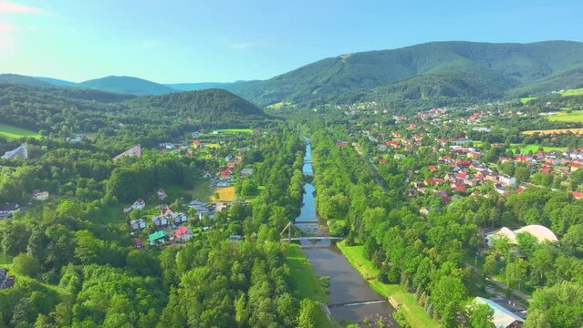 e Vistula river flowing through Ustroń and the view from the drone. Sunny summer day.