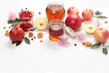 Apples, honey,pomegranate and dried apricots on a bright white background,The concept of the Jewish holiday Rosh Hashanah top view with a place for your text,Jewish New Year and Thanksgiving,