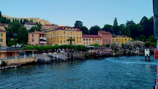 4K footage of Bellagio town in Como lake from ferry boat passing by the coast