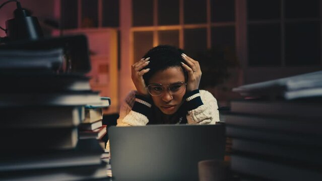 Young woman feeling overwhelmed by office work or studying, academic pressure