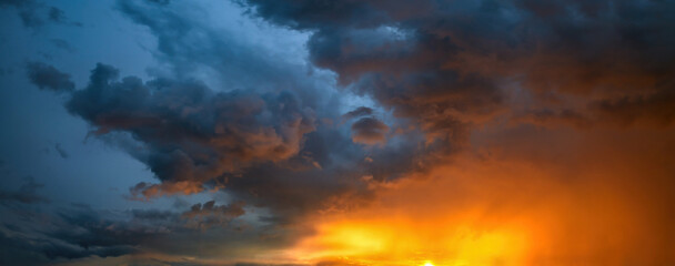 Nice evening stormy dramatic sunset sky with colorful clouds, nature and backgrounds