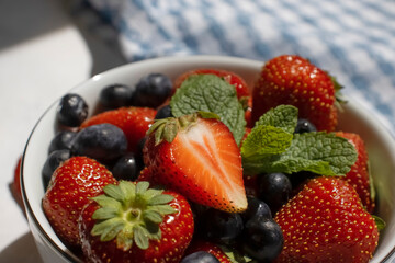 Strawberry, blueberry, mint in a bowl