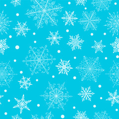 Christmas seamless pattern of beautiful complex white snowflakes on light blue background. Winter illustration with falling snow