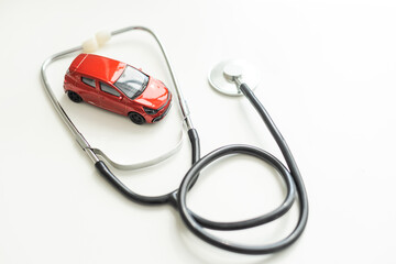 Car diagnostics, stethoscope and car on white background, concept of car inspection, repair and...