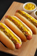 Homemade Gourmet Hot Dogs with Sweet Relish and Mustard, side view. Close-up.