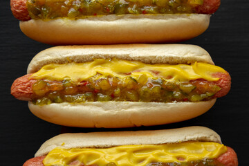 Homemade Gourmet Hot Dogs with Sweet Relish and Mustard, top view. Flat lay, overhead, from above.