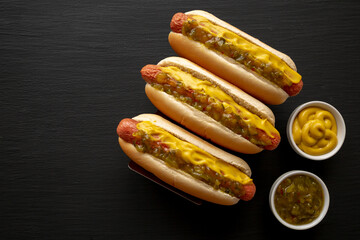 Homemade Gourmet Hot Dogs with Sweet Relish and Mustard, top view. Flat lay, overhead, from above.