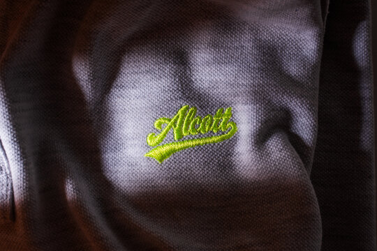 Alcott brand detail on polo shirt.  Udine Italy_August 07 2023