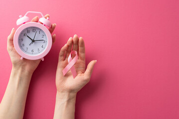 Breast Cancer Awareness Month representation. High-angle photograph featuring a woman's hands...