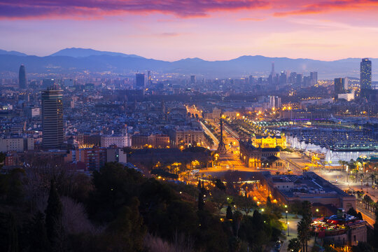 Aerial view of Barcelona on Mediterranean coast with seaport in evening. High quality photo