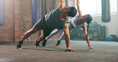 Health, fitness and exercise with couple in gym for workout, stretching and coaching. Personal trainer, body and class with man and woman training for wellness, side plank and challenge together - Powered by Adobe