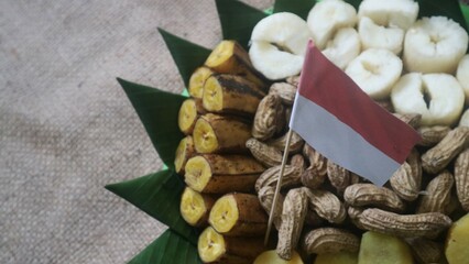 Polo pendem merah putih, is Javanese traditional food including cassava, sweet potatoes, peanuts, ose, banana with red white ribbon flag. Indonesia indpendence day celebration