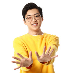 Young Asian man showing hands on white background