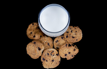 Cookies and milk isolated on black background