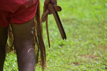 Australian Aboriginal man hunting with a boomerang