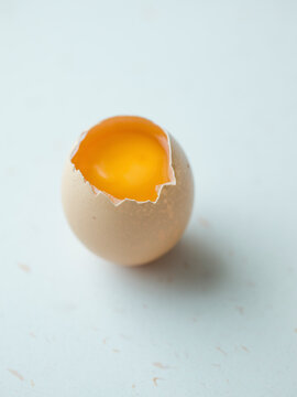 Cracked egg on white
