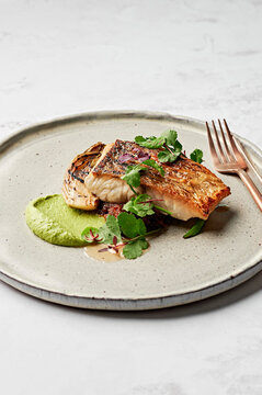 Barramundi fish, leek puree, seafood XO sauce, braised witlof, charred broccolini