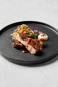 Szechuan & black pepper crusted chicken, soba noodle, pickled carrot & cucumber salad, tofu cream