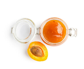 Jar with sweet apricot jam on white background