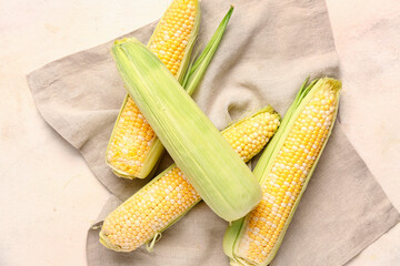 Fresh corn cobs on white background
