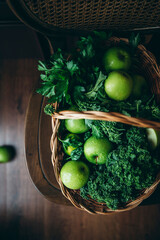 A selection of healthy green foods, including apples and kale.