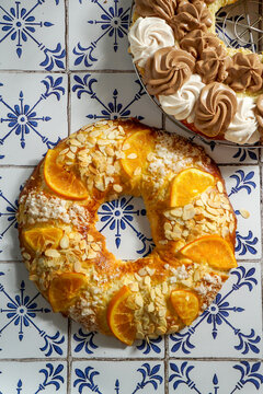 traditional Christmas cake roscon de reyes with figurines of the Three Kings with cream, chocolate and turron, Spanish and Mexican tradition
