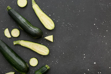 Fresh green zucchini on black background