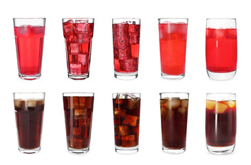 Set of tasty refreshing soda drinks with ice cubes on white background