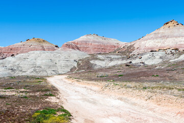 Badlands Topography off South Camp Road in Grand Junction, Colorado with curving dirt road