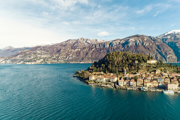 Aerial view of  Bellagio village on Como lake with blue sky and the Alps in the background, Bellagio, Como, Italy