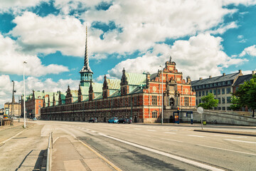 waterfront building & former stock exchange in Copenhagen with a striking spire, Denmark