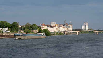 Naklejka premium A barge on the Seine in the town of Corbeil-Essonnes in the Paris region of France 