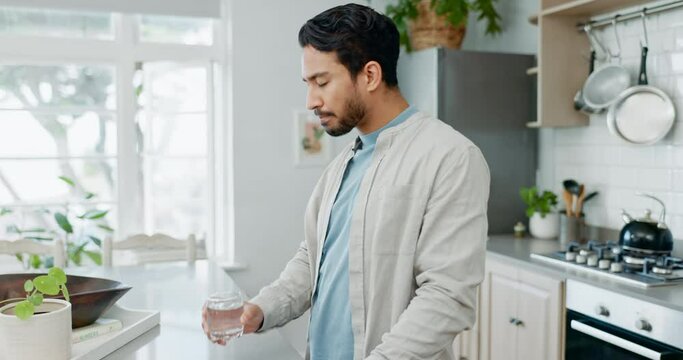Tablet, home and man drinking water for medicine, nutrition supplements and medication for illness recovery. Asian male person, glass and swallow pills, daily vitamins or medical treatment in morning