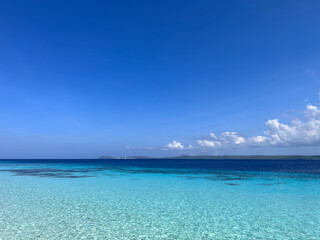 Bright turquoise blue water off the coast of the island of Bonaire in the Caribbean Sea