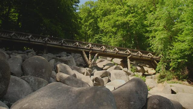 Felsenmeer in Odenwald Sea ​​of ​​rocks with bridge Wood Nature Tourism on a sunny day steady shot
