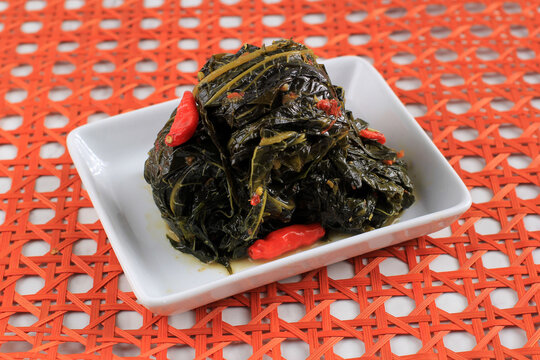 Buntil Daun Pepaya, Boiled  Papaya Leaves with Spiced Shredded Coconut Inside